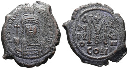 Maurice Tiberius, AD 582-602. AE, Follis. 9.65 g. 31.81 mm. Constantinople.
Obv: DN MAVRIC TIBER PP AVG. Helmeted and cuirassed bust facing, holding c...