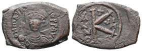 Maurice Tiberius, AD 582-602. AE, Half Follis. 5.14 g. 23.78 mm. Thessalonica.
Obv: D N MA TIBE PP. Crowned, draped and cuirassed bust facing, holding...