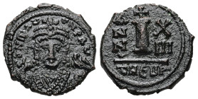Maurice Tiberius, AD 582-602. AE, Decanummium. 2.60 g. 17.36 mm. Theoupolis (Antioch). 
Obv: Frontal bust of Maurice wearing loros and crown with cros...
