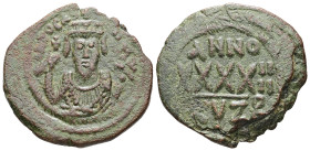 Phocas, AD 602-610. AE, Follis. 9.51 g. 29.93 mm. Cyzicus.
Obv: D N FOCAS PЄRP AVG. Crowned bust facing, wearing consular robes and holding mappa and ...