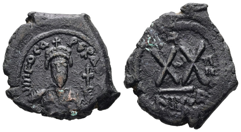 Phocas, AD 602-610. AE, Half Follis. 6.32 g. 25.27 mm. Nicomedia.
Obv: Frontal b...