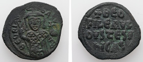 Theophilus, AD 829-842. AE, Follis. 6.70 g. 29.55 mm. Constantinople.
Obv: ΘEOFIL-bASIL. Crowned, three-quarter length figure of Theophilus facing, pe...