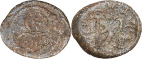 Luni. Periodo Vescovile (VII-VIII sec.). Tessera in piombo. D/ Busto stilizzato di fronte. R/ Monogramma del Vescovo Venanzio (?). CNI 1/12; MIR (Tosc...