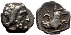 Lycaonia, Laranda AR Obol (Silver, 0.60g, 10mm) ca 324/3 BC. 
Obv: Head of Herakles to right. 
Rev: Λ Forepart of a wolf to right. 
Ref: Göktürk 70 ff...
