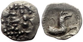 Lycaonia, Laranda AR Obol (Silver, 0.41g, 11mm) ca 324-323 BC. 
Obv: Facing head of Herakles 
Rev: Forepart of wolf to right; inverted crescent above....