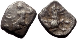 Lycaonia, Laranda AR Obol (Silver, 0.66g, 10mm) ca 324/3 BC.
Obv: Baaltars seated left, torso facing, holding grain ear and grape bunch in extended r...