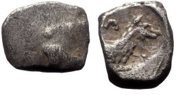 Lycaonia, Laranda AR Obol (Silver, 0.63g, 9mm) ca 324/3 BC.
Obv: Baaltars seated left, torso facing, holding grain ear and grape bunch in extended ri...