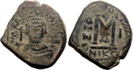 Heraclius (610-641) AE (Bronze, 11.07g, 30mm) Nicomedia. Overstriked
Obv: Helmeted and cuirassed bust facing, holding globus cruciger and shield decor...