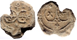 Byzantine Lead Seal (10.79g, 25mm)
Obv: A monogram incorporating small letters within two large circular letters forming Θ Ε.
maybe: Θεοτόκε βοήθει...