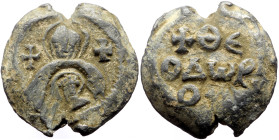 Byzantine Lead Seal (12.26g, 25mm) Seal of Theodore (seventh century).
Obv: Bust of the Virgin, facing, with medallion of Christ before her. Both are...