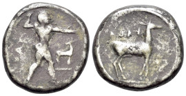 Bruttium, Kaulonia, c. 475-425 BC. AR Nomos (19mm, 7,87 g, 9h). Apollo advancing right, holding branch; small daimon running right on Apollo's left ar...