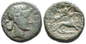 Sicily, Katane, c. 2nd century BC. Æ (26mm, 7.43g). Head of Dionysos r., wearing ivy wreath. R/ Dionysos, holding kantharos and thyrsos, reclining l. ...