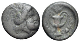 Thessaly, Peparethos. 4th-3rd centuries BC. Chalkous (Bronze 14.5mm, 1.80g, 6 h). Obv. Bearded head of Dionysos to right, wearing ivy wreath. Rev. Π -...
