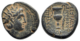 Seleukid Kings, Antiochos VI (145-142 BC). Æ (17.5mm, 5.96g, 12h). Apamea on the Orontes. Radiate and diademed head . R/ Amphora; palm to r.; monogram...