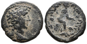 Claudius ? (41-54). Cilicia, Uncertain Caesarea. Æ (21mm, 5.60g). Bare head r. R/ Tyche seated r. on rocks, holding grain ears; below, river-god swimm...