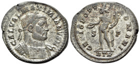 Galerius (Caesar, 293-305). Æ Follis (29mm, 10.28g, 12h). Treveri. Laureate and cuirassed bust r. R/ Genius standing l., holding patera and cornucopia...