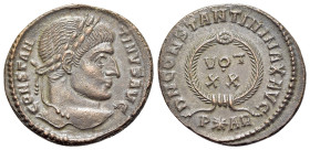 Constantine I (307/310-337). Æ Follis (19mm, 2.96g, 11h). Arelate, 322-3. Laureate head r. R/ VOT / XX in two lines; all within wreath; P-star-AR. RIC...