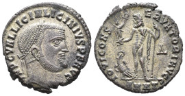 Licinius I (308-324). Æ Follis (18mm, 345g). Heraclea, AD 313. Laureate head r. R/ Jupiter standing front, head l., holding Victory on globe and scept...