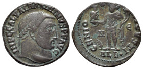 Maximinus II (309-313). Æ Follis (20mm, 3.84g, 11h), Alexandria, 312-313. Laureate head r. R/ Genius standing l.,holding bust of Serapis and cornucopi...