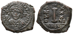 Justinian I (527-565). Æ 10 Nummi (19mm, 5.46g). Antioch, year 26. Helmeted and cuirassed bust facing, holding globus cruciger; cross to r. R/ Large I...