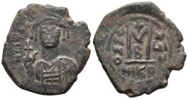 Maurice Tiberius (582-602). Æ 40 Nummi (29mm, 11.87g). Nicomedia, year 19. Helmeted and cuirassed bust facing, holding globus cruciger and shield. R/ ...