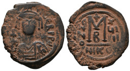 Maurice Tiberius (582-602). Æ 40 Nummi (28mm, 11.58g). Nicomedia, year 19. Helmeted and cuirassed bust facing, holding globus cruciger and shield. R/ ...