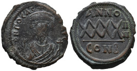 Phocas (602-610). Æ 40 Nummi (28mm, 11.34g). Constantinople, year 4. Crowned bust facing, wearing consular robes, holding mappa and cross. R/ Large XX...