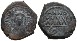 Phocas (602-610). Æ 40 Nummi (30.5mm, 12.64g). Constantinople, year 5. Crowned bust facing, wearing consular robes, holding mappa and cross. R/ Large ...