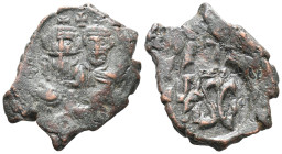 Heraclius (610-641). Æ 40 Nummi (20mm, 5.78g). Syracuse, 632-641. Countermarked on an overstruck of Heraclius, Constantinople: crowned facing busts of...
