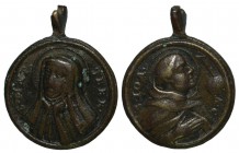 Medalha religiosa do séc. XVIII:

Sta. Teresa de Jesus / S. João da Cruz. Circular Ø 21 mm, bronze, MBC.