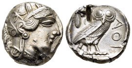 ATTICA. Athens.(Circa 454-404 BC).Tetradrachm.

Obv : Helmeted head of Athena right.

Rev : AΘE.
Owl standing right, head facing; olive sprig and...