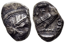 ATTICA.Athens.(Circa 454-404 BC).Tetradrachm.

Obv : Helmeted head of Athena right.

Rev : AΘE.
Owl standing right, head facing; olive sprig and ...