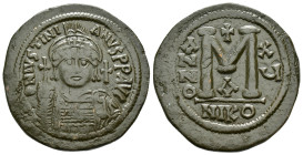 JUSTINIAN I.(527-565).Cyzikos.Follis.

Obv : D N IVSTINIANVS P P AVG.
Helmeted and cuirassed bust facing, holding globus cruciger and shield; cross...