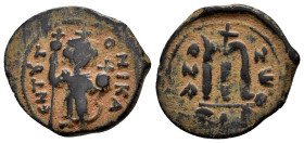 UMAYYAD.Time of the Rashidun.Pseudo-Byzantine.( 632-660).Fals.

Obv : EN T૪TO NIKA.
Imperial figure standing facing, wearing crown surmounted by cr...