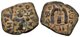 ARAB BYZANTINE.Uncertain.(647-670).Fals.

Obv : CѠT૪TO NIKA.
Standing Imperial figure holding long cross and globus cruciger.

Rev : Large M; sta...