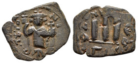 ARAB BYZANTINE.imitating the types of Constans II.Uncertain.(640-650).Fals.

Obv : ЄN T૪TO NIKA.
Standing Imperial figure holding long cross and gl...