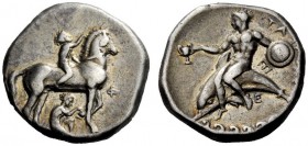 GREEK COINAGE 
 Calabria, Tarentum 
 Nomos circa 340-335 BC, AR 7.79 g. Nude youth r., crowning his horse. Rev. Dolphin rider dismounting l. Fischer...