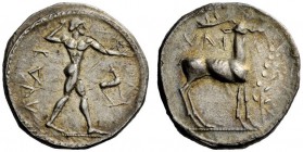 GREEK COINAGE 
 Caulonia 
 Nomos circa 475-425 (?) BC, AR 8.05 g. Apollo standing r., holding branch in r. hand, small daimon running r. on extended...