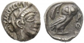 GREEK COINAGE 
 Attica, Athens 
 Hemiobol after 449 BC, AR 0.36 g. Head of Athena r., wearing Attic helmet decorated with olive leaves and palmette....