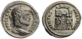 THE ROMAN EMPIRE 
 Diocletian, 284 – 305 
 Argenteus circa 295, AR 3.48 g. Laureate head r. Rev. Seven-turreted camp gate with the four tetrarchs sw...