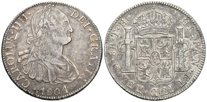 CARLOS IV. 8 Reales. 1804. México TH. Cal-701. Ar. 26,91g. Restos de metal en an...