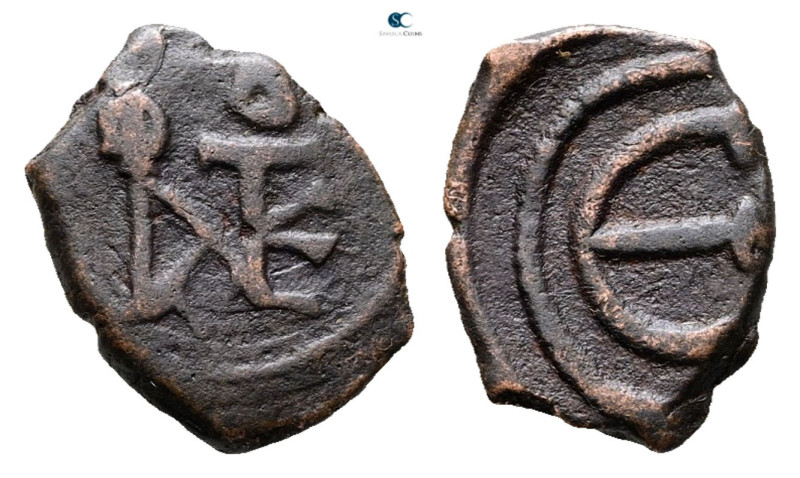 Justin II AD 565-578. Uncertain mint
Pentanummium Æ

15 mm, 1,52 g



Nea...