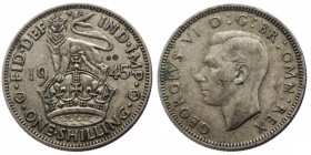 United Kingdom, 1 Shilling (Silver, 5.59g, 25mm) George VI Obv: GEORGIVS VI D:G:BR:OMN:REX / HP, Uncrowned portrait of King George VI left, legend aro...