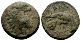 Macedon, Pydna. Ca. 381-369 BC. Æs, 4.35 g. Head of young Herakles right, wearing lion skin / [Π]YΔNA[IΩN] eagle standing right, holding serpent in ta...