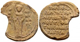 Byzantine, Stephanos Xanthos. Byzantine lead seal (40 mm, 47.82 gram). Last third 12th-early 13th century AD. Saint Nicholas standing, nimbate, wearin...