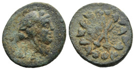 LYDIA. Blaundos. (Circa 200-133 BC)
Ae Bronze (17,9mm 3,3g)
Obv: Head of Dionysos right
Rev: Filleted Two thyrsos,leaf wreath around two flowers on...