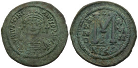 Justinian I (AD 527-565). Nicomedia. Dated RY 17 (543/4)
AE Follis (40,1m 19,5g)
Obv: DN IVSTINIANVS PP AVG. Helmeted and cuirassed bust facing, hol...