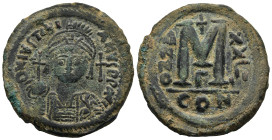 Justinian I (527-565 AD). Constantinople.
AE Follis (33,2mm 18,3g)
Obv: DN IVSTINIANVS PP AVG, Helmeted and cuirassed bust facing, holding globus cr...