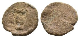 Tessera
Obv: Amphora
Rev: Blank
(1g 11,9mm diameter)