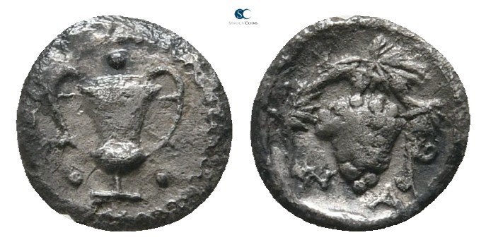 Sicily. Naxos 461-430 BC. 
Tetras AR

7 mm., 0,19 g.

Kantharos; around, th...